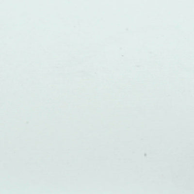 A closeup video of a man stamping on white paper, leaving the impression of three bats flying across a circle silhouette.