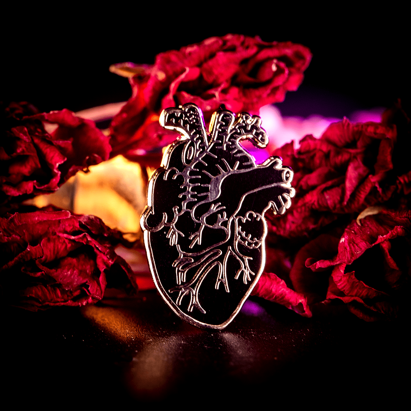 Black and silver anatomical heart enamel pin, goth style, by The Roving House