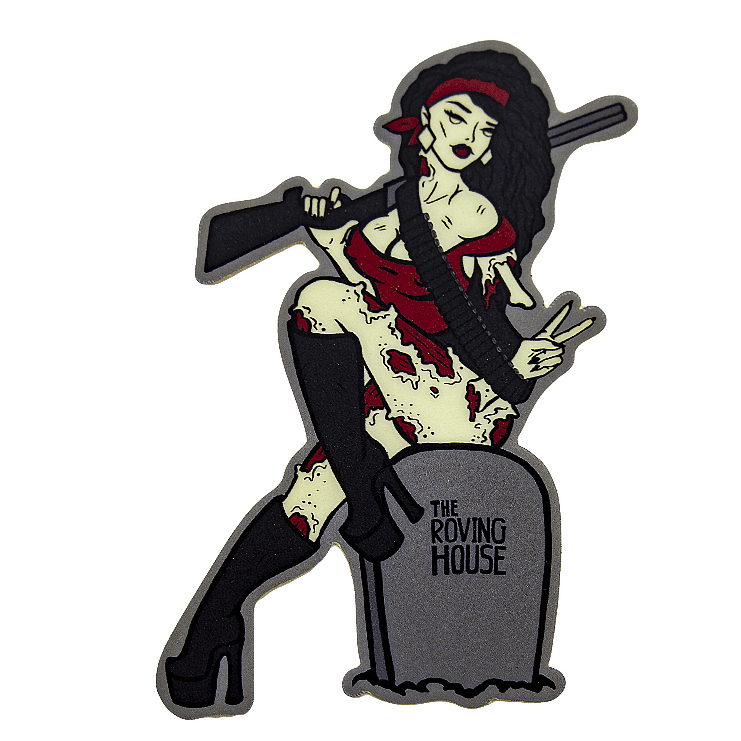 A vinyl sticker of an attractive, buxom zombie woman with greenish white skin, white eyes, black hair, and red flesh wounds. She sits on a grey gravestone that reads "THE ROVING HOUSE", holding a shotgun.
