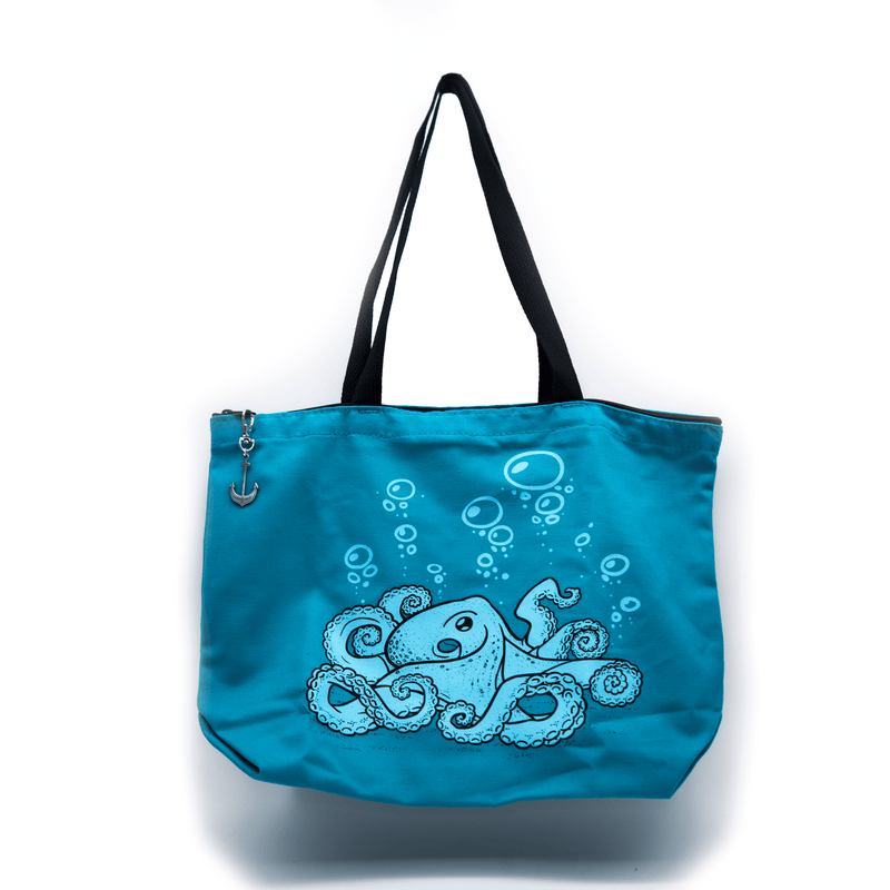 A turquoise tote bag featuring line art of an octopus and bubbles floating upwards. The zipper has a metal anchor shaped pull.