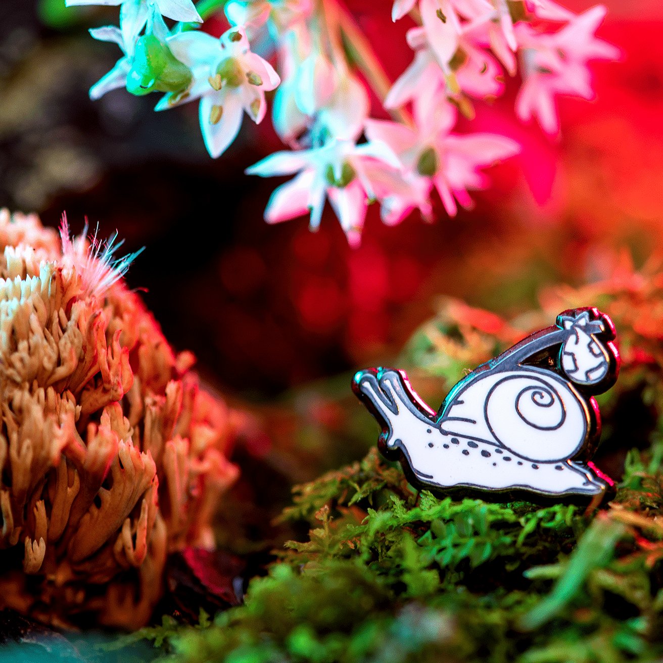 Rover the Snail Mini Pin by The Roving House Snail pin, featuring a hobo or runaway snail with a bindle exploring the moss, mushrooms, and garlic flowers.